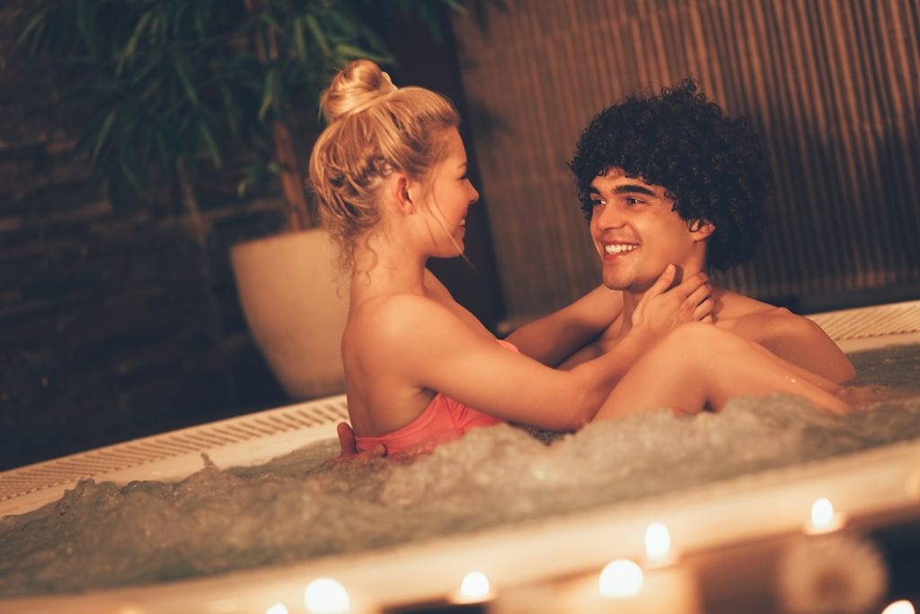 Couple Relaxing In Jacuzzi